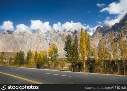 Nature landscape view of clouds cover Passu cones cathedral mountain peaks along paved road in Karakoram highway, Gojal Hunza valley. Gilgit Baltistan, safe and peaceful Pakistan