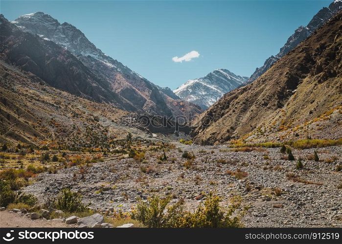 Nature landscape view of wilderness area surrounded by snow capped mountains in Karakoram range, Skardu. Gilgit Baltistan, Pakistan.