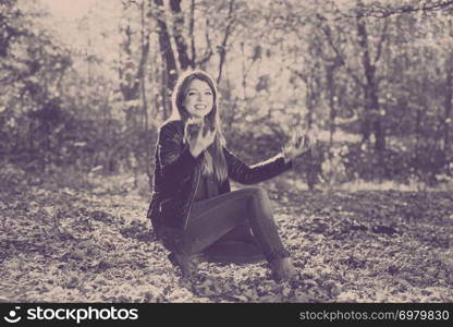 Nature outdoor playing relax leisure concept. Crazy girl throwing leaves. Euphoric woman tossing around autumnal foliage having time of her life.. Crazy girl throwing leaves.