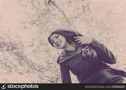 Nature, outdoors concept. Young lady enjoying free time in the park. . Young lady enjoying free time in the park.