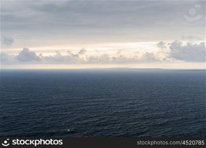 nature, seascape and landscape concept - view to ocean at wild atlantic way in ireland