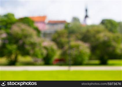 nature, season, background and landscape concept - blurred summer old city and park bokeh