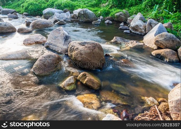 Nature small waterfall with rock in Thailand