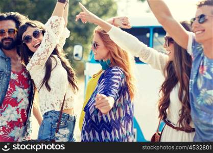 nature, summer, youth culture and people concept - happy young hippie friends dancing over minivan car outdoors