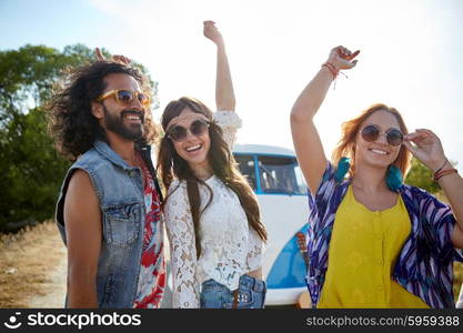 nature, summer, youth culture and people concept - happy young hippie friends dancing over minivan car outdoors