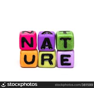 nature - word made from multicolored child toy cubes with letters