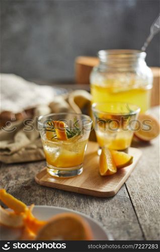 Navel orange cocktail with rosemary.
