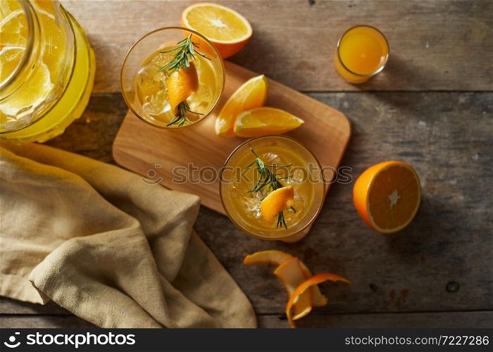 Navel orange cocktail with rosemary.