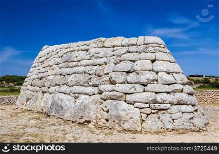 Naveta des Tudons - ancient megalithic chamber tomb at Menorca island, Spain. It served as collective ossuary between 1200 and 750 BC and represet one of the oldest ancient structures in Europe.