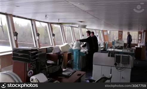 Navigation officer driving the cruise liner on the river