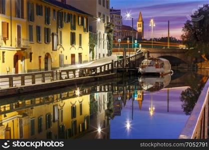 Naviglio Grande canal in Milan, Lombardia, Italy. Bridge across the Naviglio Grande canal at sunrise, Milan, Lombardia, Italy