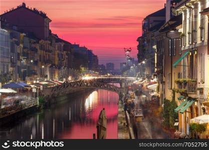 Naviglio Grande canal in Milan, Lombardia, Italy. Bridge across the Naviglio Grande canal at sunset, Milan, Lombardia, Italy