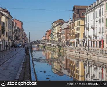 Naviglio Grande Milan. MILAN, ITALY - MARCH 28, 2015: Tourists at the Naviglio Grande canal waterway in Milan Italy