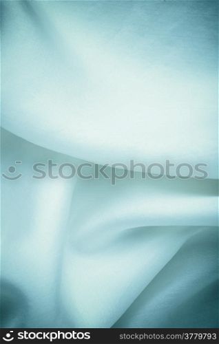 Navy blue cloth. Folds of silk elegant textile fabric as background texture wallpaper.