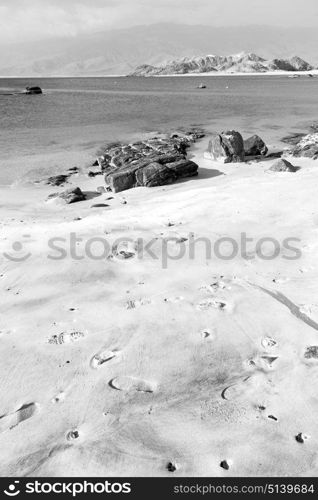 near sandy beach sky and mountain in oman arabic sea