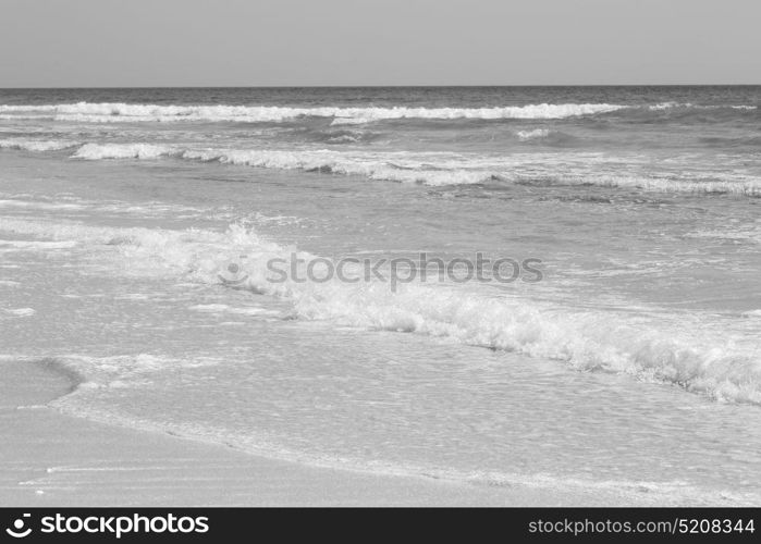 near sandy beach sky and mountain in oman arabic sea