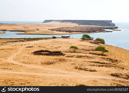 near sandy beach sky and mountain in oman arabic sea the hill