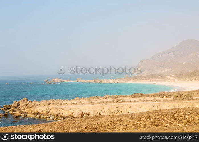 near sandy beach sky and mountain in oman arabic sea the hill