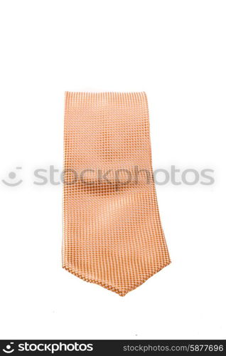 Neatly roled up tie of a peach colour, with point of tie facing forward, on a white background.