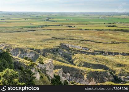 Nebraska farmland as seen from a summit of Scotts Bluff National monument in late summer scenery, travel concept