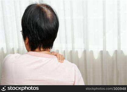 neck and shoulder pain, old woman suffering from neck and shoulder injury, health problem concept