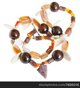 necklace from mineral stones (agate, amber,nacre) and wooden balls isolated on white background