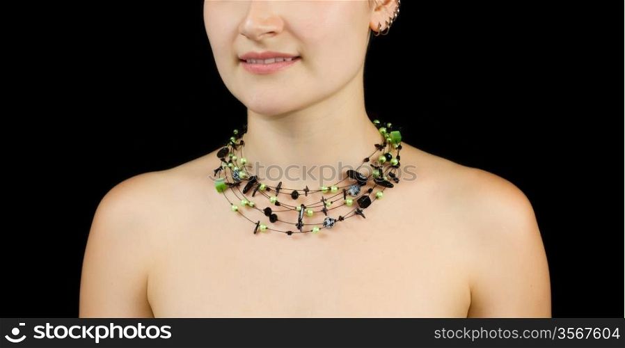 Necklace on the background of the female body