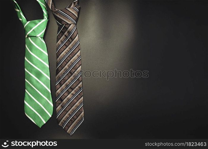 Necktie on dark shadow black background with copy space, International Men&rsquo;s Day and Fathers Day concept. space for text modern design. Necktie on dark shadow black background with copy space, International Men&rsquo;s Day and Fathers Day concept.