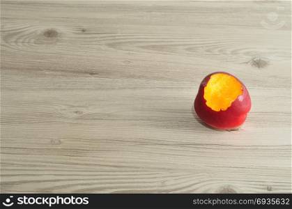 nectarine with a bite taken out of it