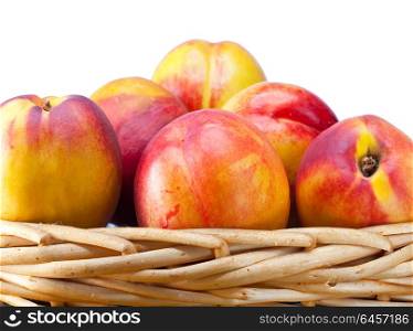 nectarines in a wattled basket