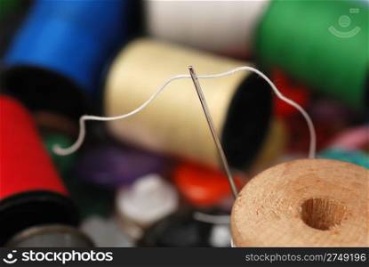 Needle and a thread. A set of accessories for sewing.