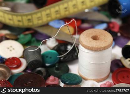 Needle and a thread. A set of accessories for sewing.