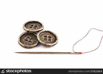 Needle and thread with three buttons