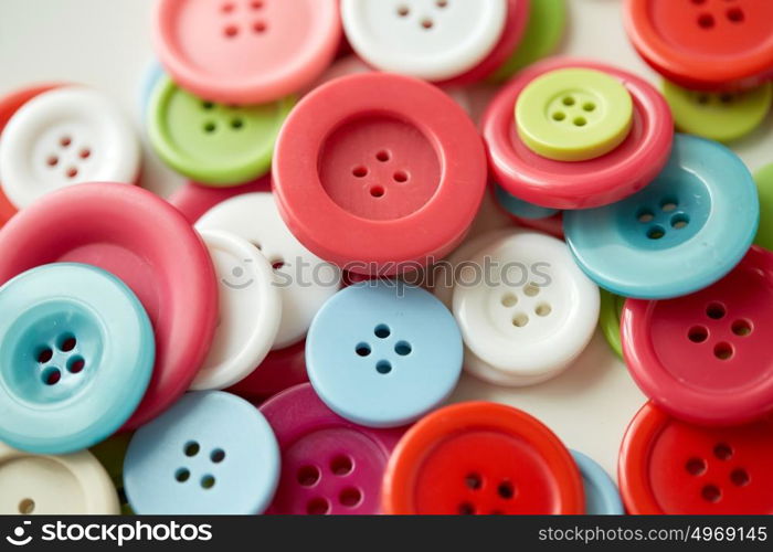 needlework and tailoring concept - sewing buttons. colorful sewing buttons