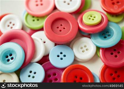 needlework and tailoring concept - sewing buttons. colorful sewing buttons