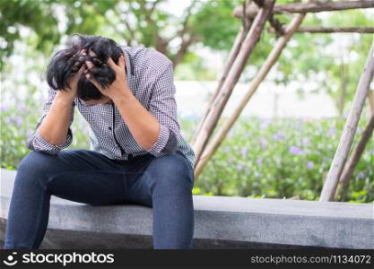 Negative emotion facial expression feelings. Stressed Asian businessman in depression with hands-on forehead because of work problems And was fired.