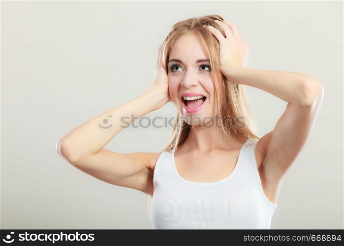 Negative human emotions, facial expressions, reaction attitude. Closeup stressed young woman covers ears with hands