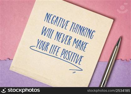 negative thinking will never make your life positive - inspirational handwriting on a napkin, personal development concept