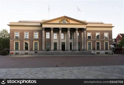 neo classical old courthouse in leeuwarden, capital of the dutch province of Friesland in warm morning light