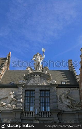 Neptune statue on the house in Gent, Belgium&#xA;