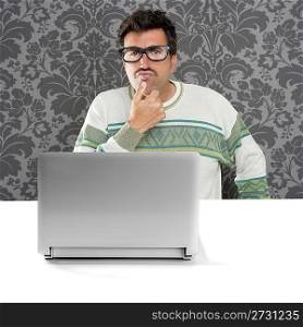 Nerd pensive man glasses silly expression laptop computer thinking a solution