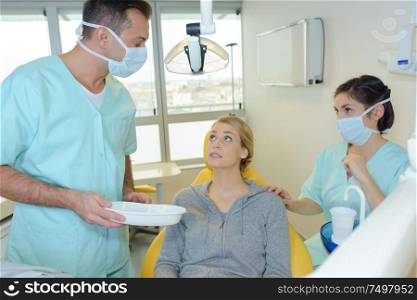Nervous patient in dentist's chair