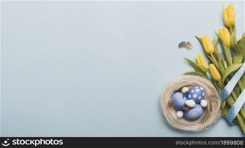 nest with colored eggs near tulips. Resolution and high quality beautiful photo. nest with colored eggs near tulips. High quality beautiful photo concept