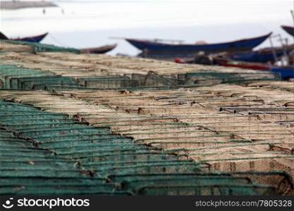 Net and boat on the sea coast in Vietnam. morning