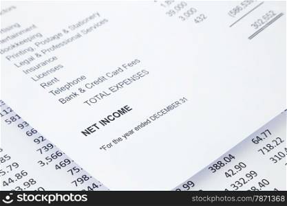 Net income word in business income statement with other detail lists in reports, accounting concept, black and white tone image