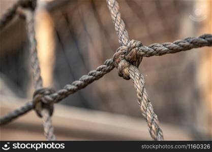 net of rope and close up view of a knot. Selective focus