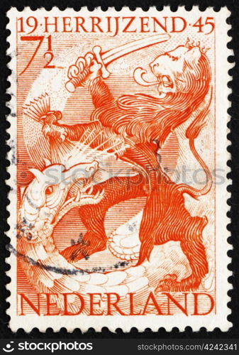 NETHERLANDS - CIRCA 1945: a stamp printed in the Netherlands shows Lion and Dragon, Liberation of Netherlands, Rising Again, circa 1945