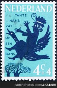 NETHERLANDS - CIRCA 1963: a stamp printed in the Netherlands shows Aunt Lucy Sat on a Goosey, Nursery Rhymes, circa 1963