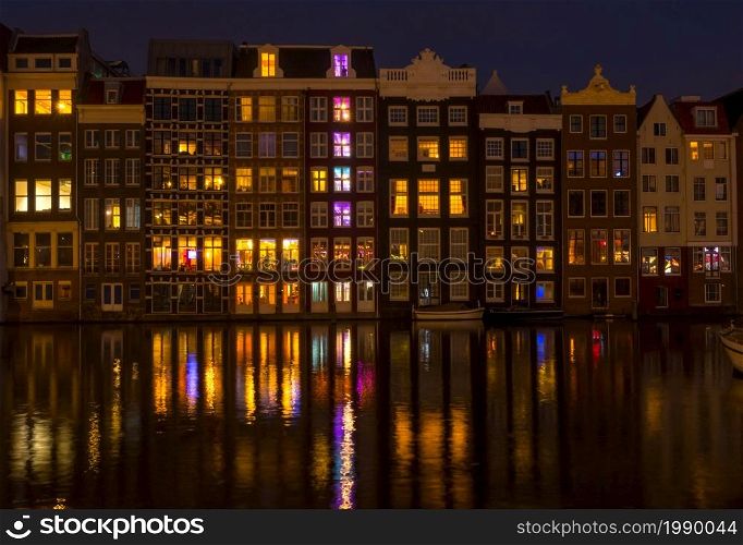 Netherlands. Classic canal houses in Amsterdam at night. Houses on the Amsterdam Canal at Night