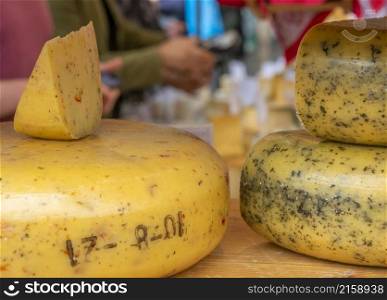 Netherlands. Farmers market in Amsterdam. Large heads of Dutch cheese. Farmer Market and Cheese